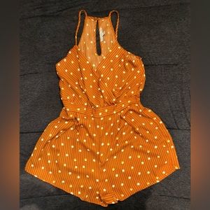 A brown romper size medium from Haute Momde